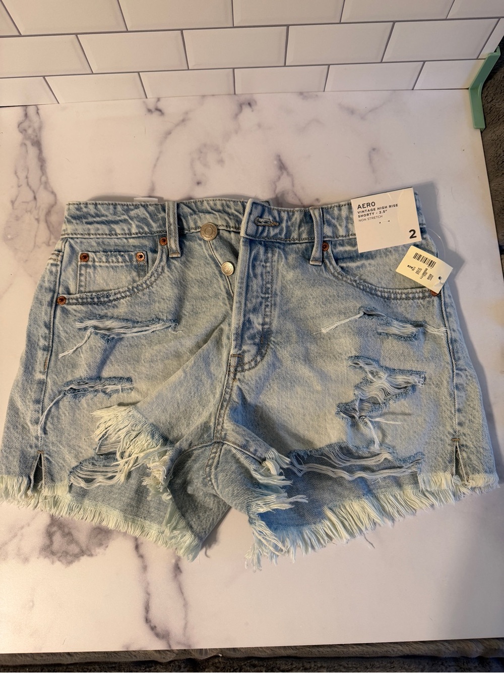 American Eagle Outfitters High-Rise Distressed Denim Shorts - Light Blue